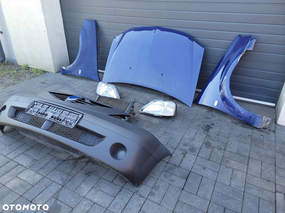 Dacia Logan I 04-08 1.4 Zestaw maska lampy blotniki chlodnica zderzak - 1