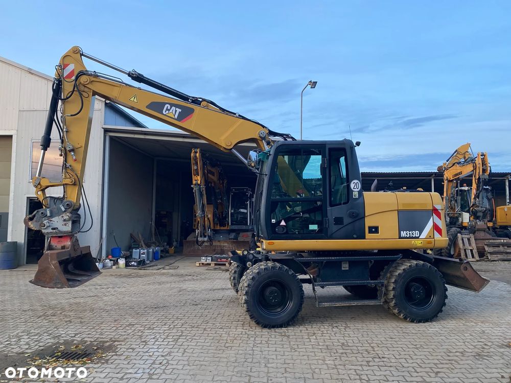 Caterpillar CAT M313D, 7500 MTH, 2015 ROK, Z NIEMIEC, - 7