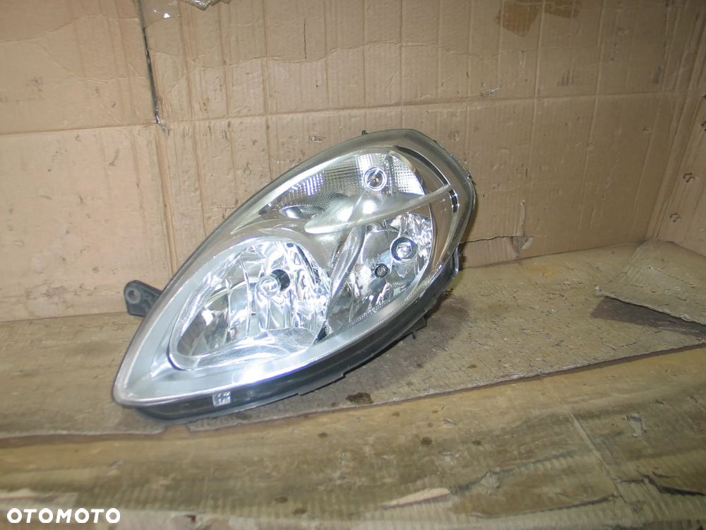 lampa przod lancia ypsilon 2 II lift 06-11r. oryginal europa - 1