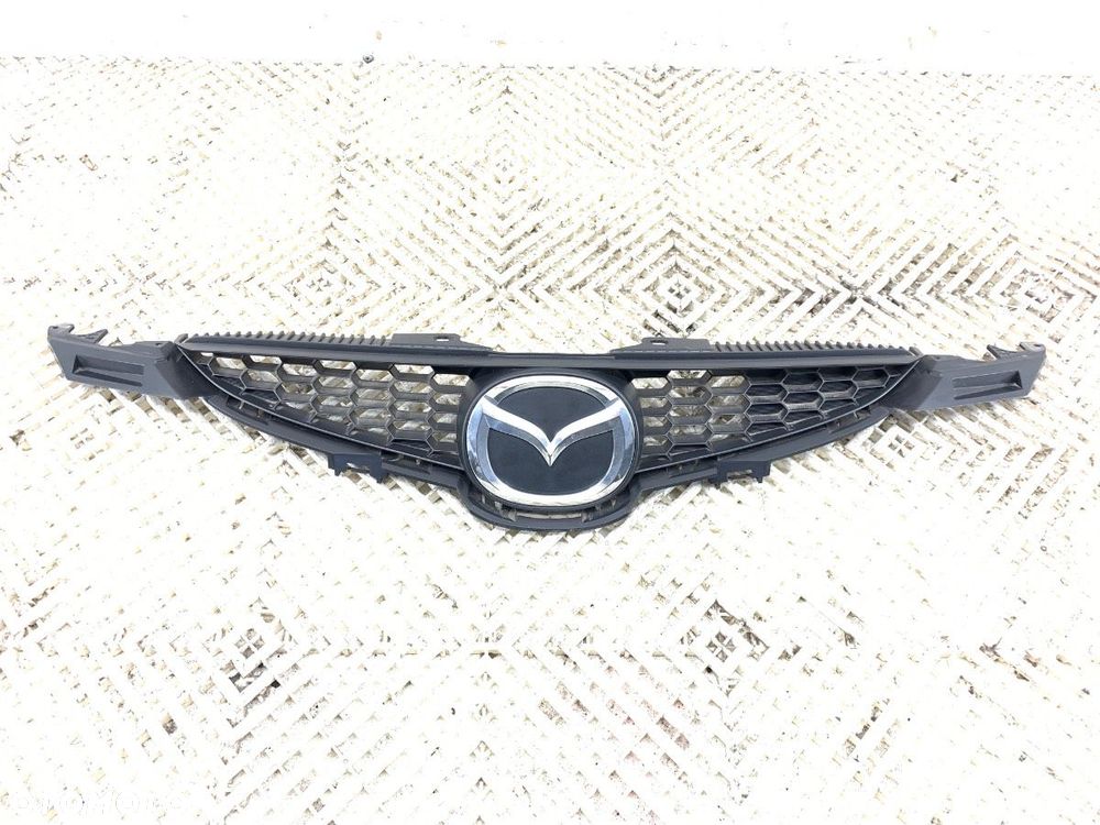 ATRAPA GRILL  MAZDA 2 (DE_, DH_) 2007 - 2015 1.3 (DE3FS) 63 kW [86 KM] benzyna 2007 - 2015 D65150711 - 1