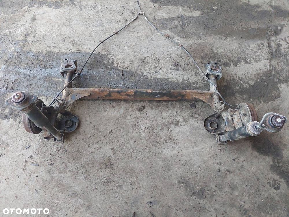 BELKA OŚ ZAWIESZENIA TYŁ BĘBNY BEZ ABS CHEVROLET AVEO I 03-07 HB 5D - 1