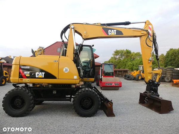 Caterpillar CAT M313D Z Niemiec / POWERTILT / Bardzo ładny stan /