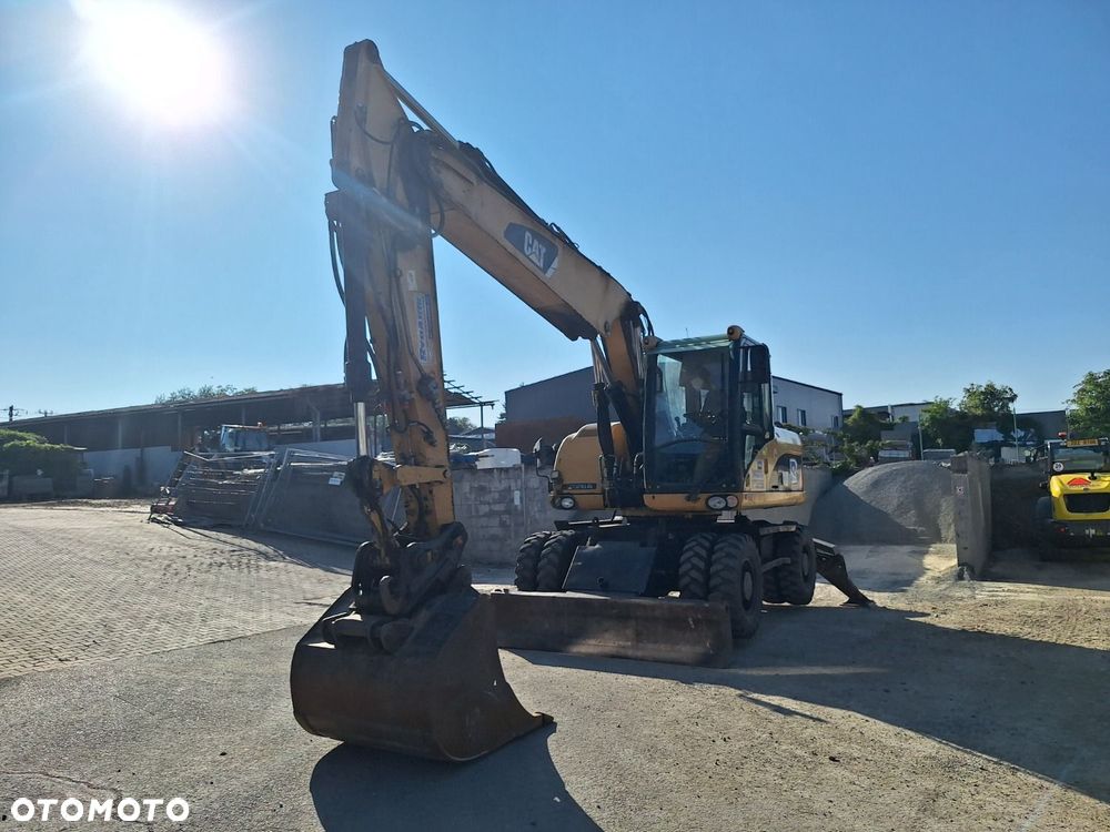 Caterpillar M315D 4X4 - 1