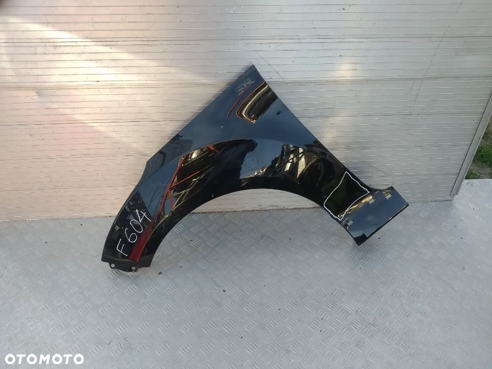 F604 LEWY BŁOTNIK HYUNDAI ACCENT - 1