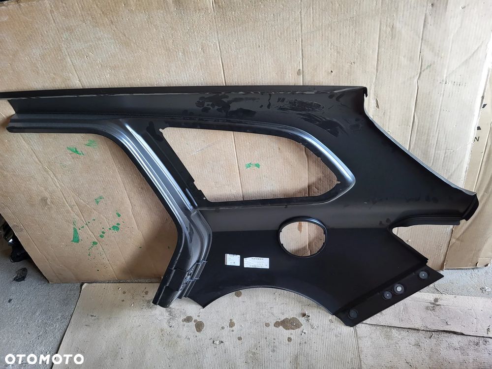 BŁOTNIK PRAWY TYŁ ASTRA J IV 4 KOMBI - 2