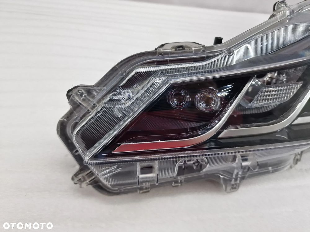 TOYOTA COROLLA E21 18- LEWA / PRAWA ZWYKŁA LAMPA PRZEDNIA PRZÓD SOCZEWKA , NR 81110-02T31-00 / 81150-02T31 / 81150-02T31-00 , NR AUKCJI LA372 - 16