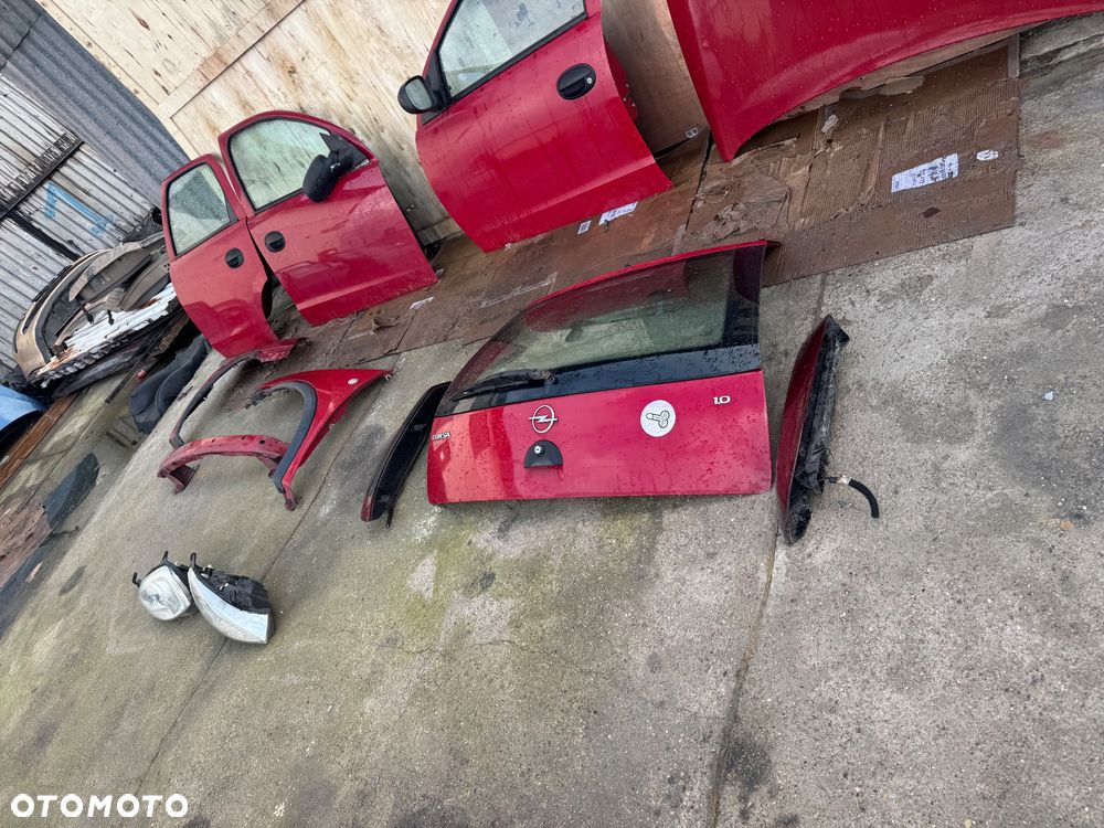 Opel Corsa c czerwone bordowe drzwi przednie przód prawe lewe maska lampy przód przednie lampy tył tylnie maska błotnik prawy lewe lampy tył belka przód - 9