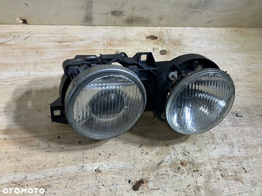 LAMPA BMW E30 HELLA PRAWA UŚMIECH REFLEKTOR E32 E34 - 2