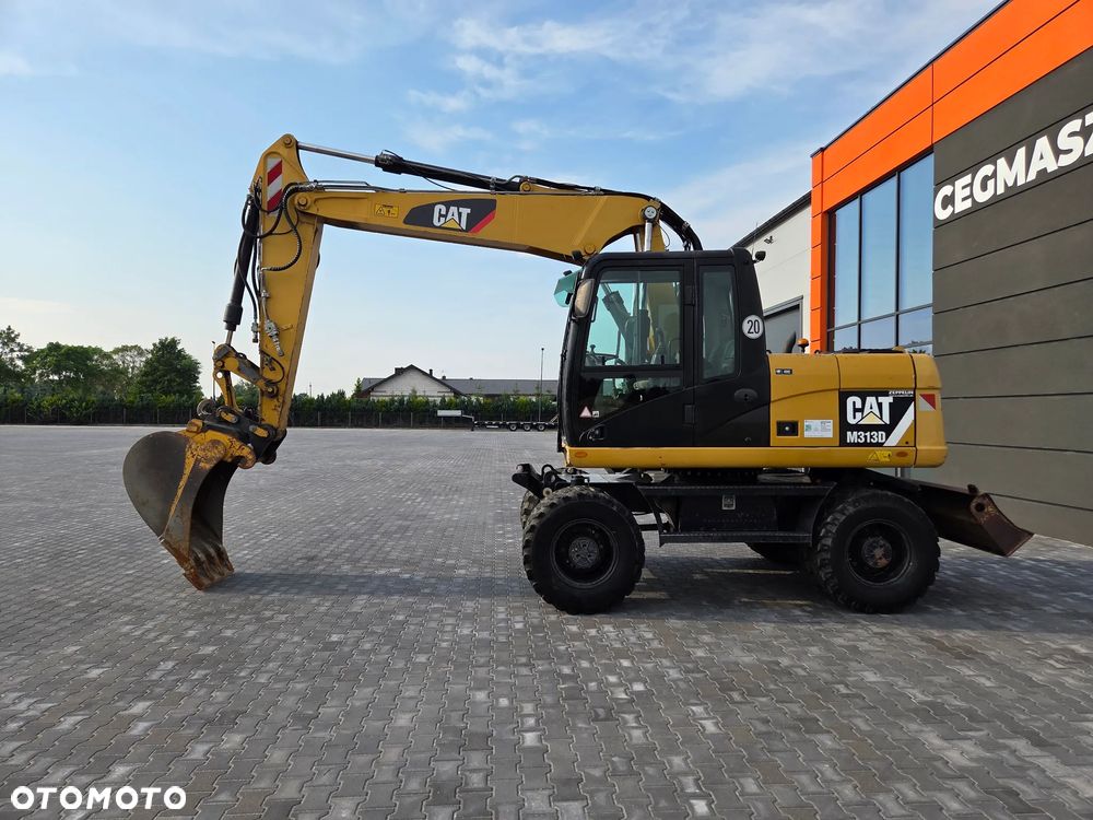 Caterpillar M313D / z Niemiec / - 2