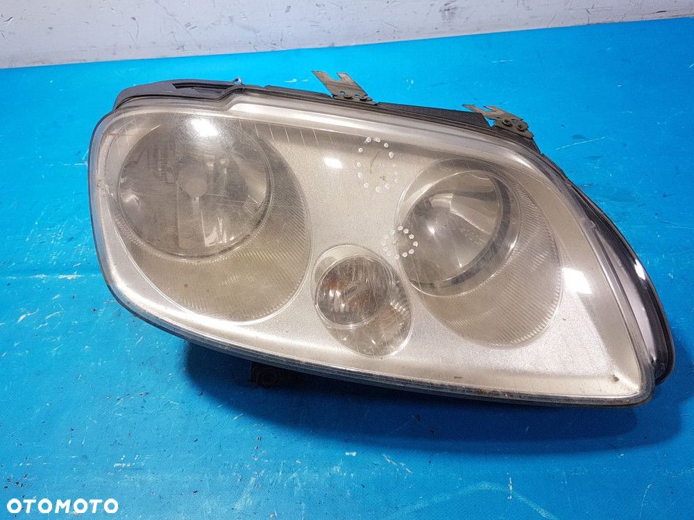 VW CADDY III REFLEKTOR LEWY - 1