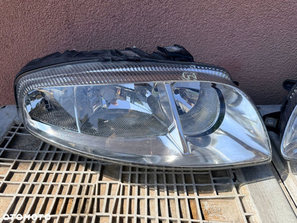 Lampa przednia ALFA ROMEO GT ZWYKŁE KOMPLET EUROPA ORYGINALNE AL - 2