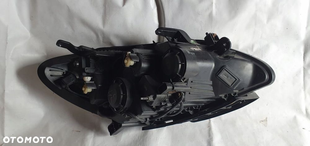 VOLVO FH4 LAMPA LEWA BI XENON 21221138 - 1