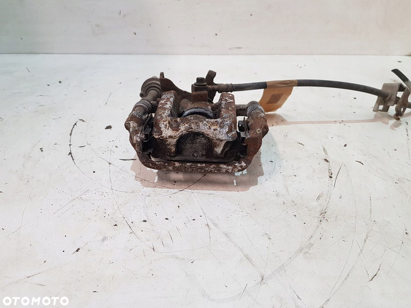ZACISK HAMULCOWY PRAWY TYŁ OPEL ASTRA J EUR - 9