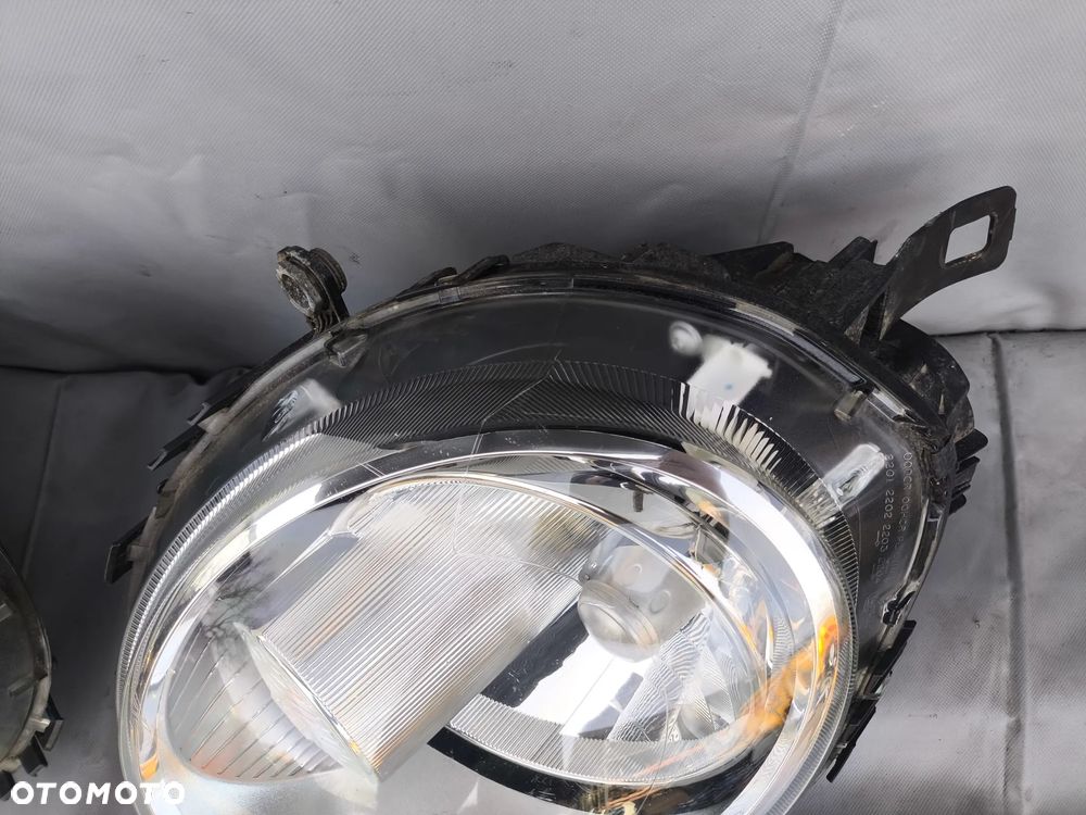 MINI COOPER R57 R55 R56 CLUBMAN LAMPA LEWA PRAWA PRZEDNIA PRZÓD 0301225704 0301225703 - 4