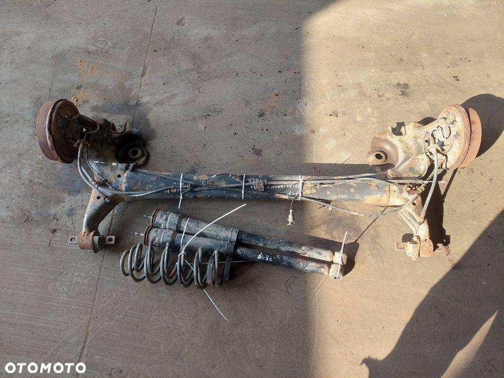 BELKA OŚ ZAWIESZENIA TYŁ BĘBNY Z ABS MITSUBISHI COLT VI ID: 238001 - 1