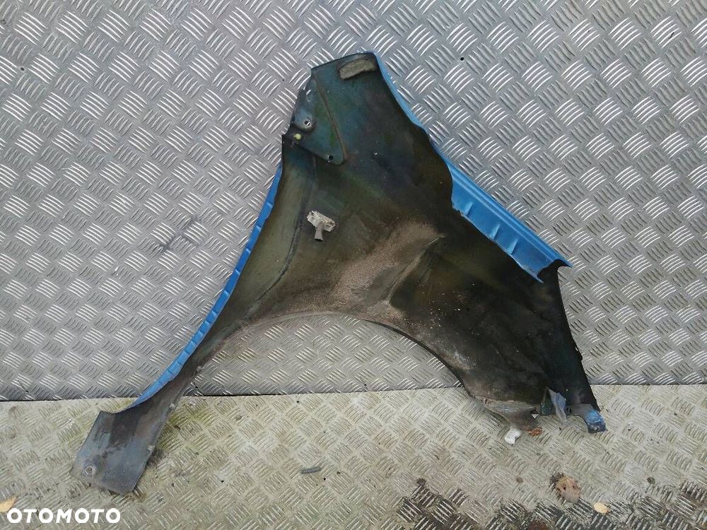 BŁOTNIK LEWY PRZEDNI NISSAN NOTE - 2
