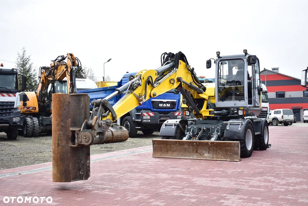Wacker Neuson EW 100 Koparka kołowa 10.5 T/ Powertilt/ 4 Łyżki/ Podpory + Pług/ 2021/ 3.700 Mth/ Sprowadzona z Austri ! - 3