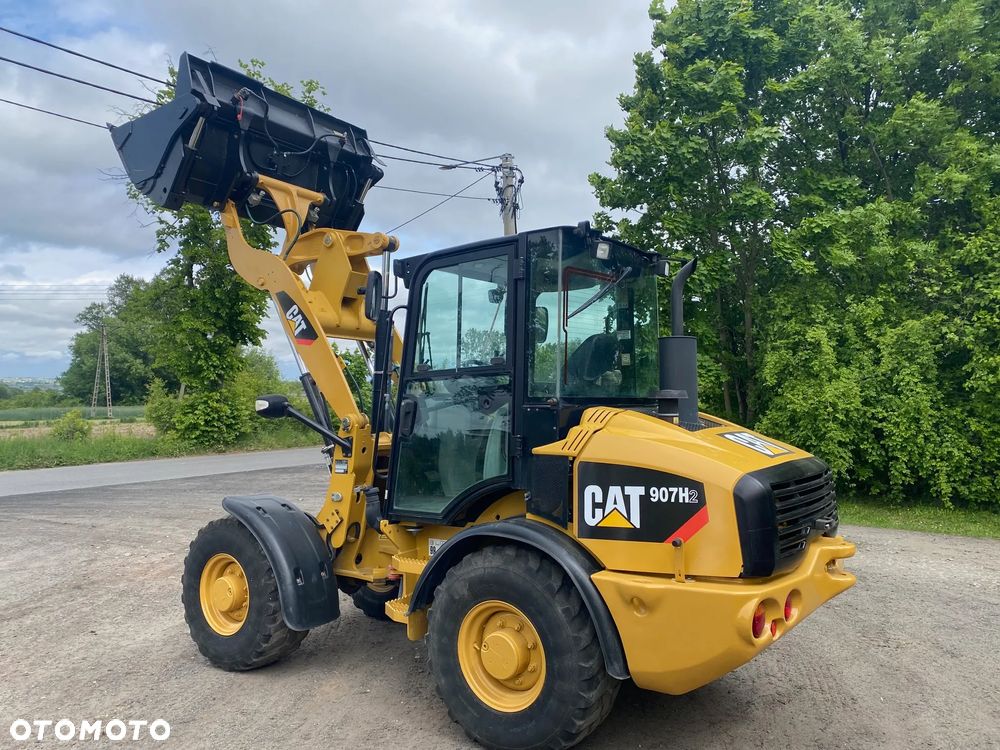 Caterpillar CAT 907H2, 2014 ROK, 4900 MTH, ŁYŻKA OTWIERANA + WIDŁY, z NIEMIEC, - 18
