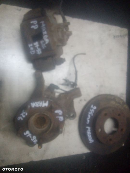 MAZDA 626 IV   91-97 rok zacisk jarzmo przód - 4
