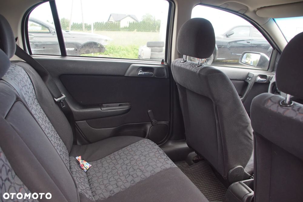 Auto na części - Opel Astra II G 1.6 16V 101 KM X16XEL F17 Z147 1999R Silnik Skrzynia Drzwi Maska Błotnik Zderzak Klapa Lampa Lusterko Klamka Szyba Deska Kokpit Sterownik Moduł Czujnik Licznik Panel Kierownica - 16
