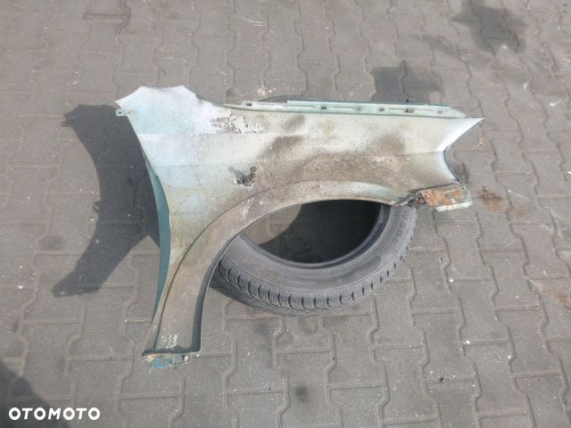 BŁOTNIK LEWY PRZÓD LEWY PRZEDNI OPEL ASTRA II G Z374 - 12