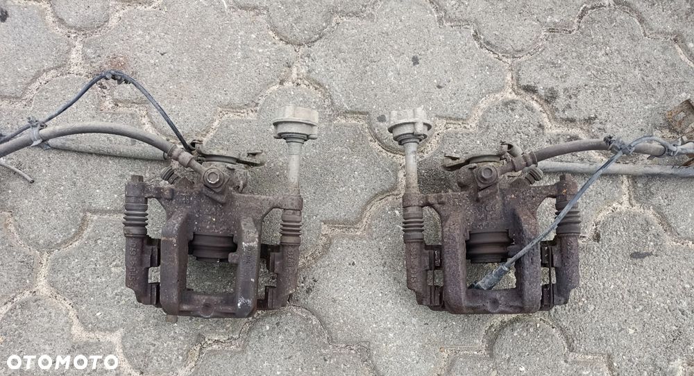 Astra J zacisk hamulcowy tylny tył 1,4 1,6 benzyna Astra IV Opel - 1