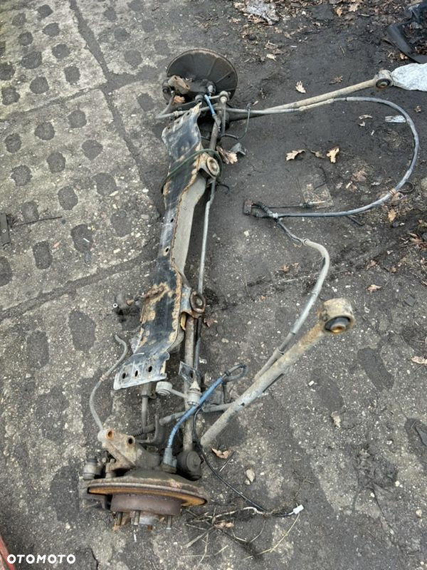 KIA CARENS II 03-06 ZWROTNICA WAHACZ BELKA ZAWIESZENIA TYL ZACISK - 3