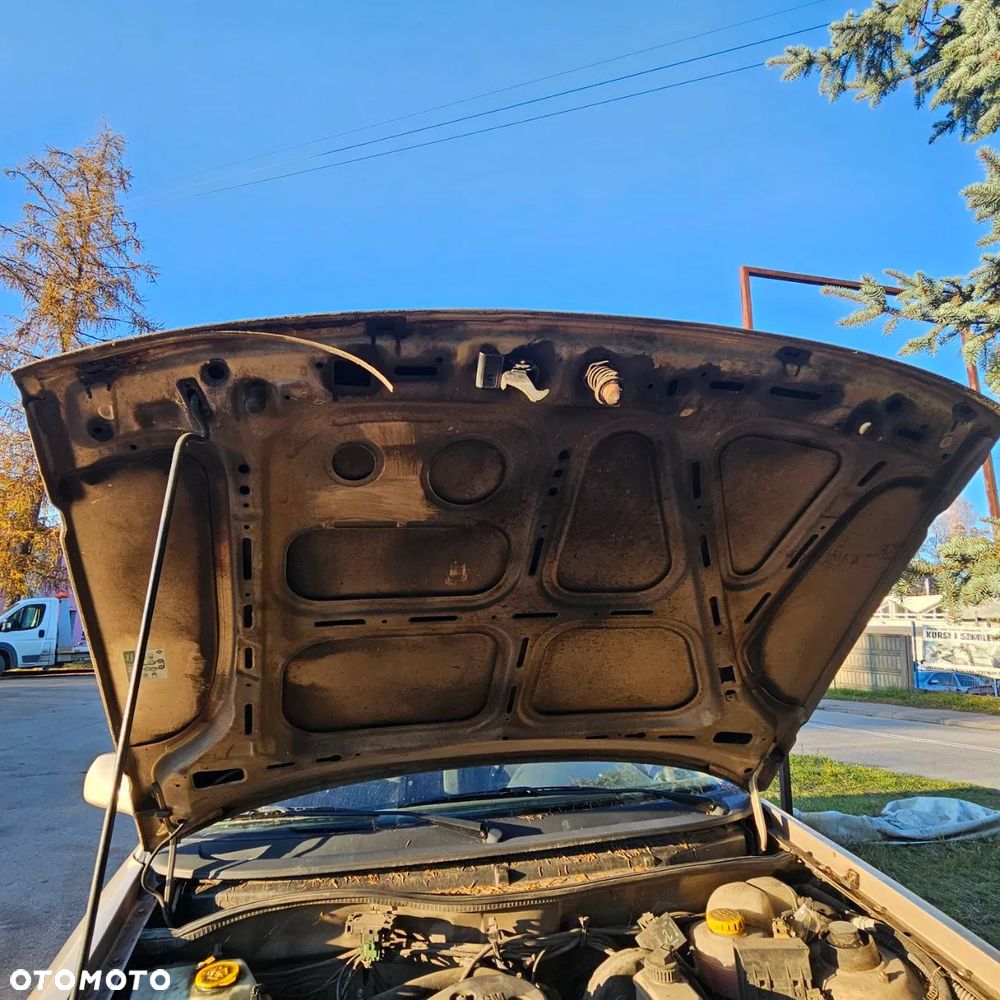 Opel Astra Classic F 1,4 B  (Z489) pojazd na części: maska, zderzak, drzwi, szyby, lusterka, chłodnica - 6