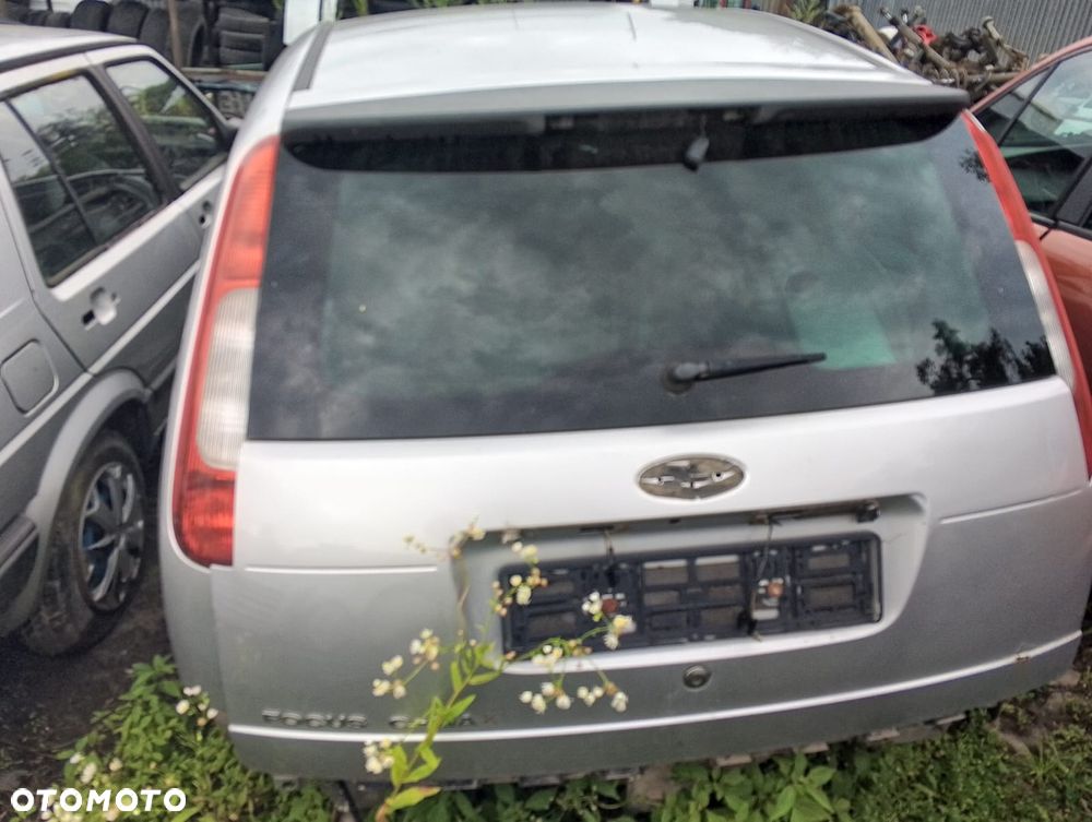 Ford Focus C-Max (03-06r.) 1.6D 119KM. Silnik DV6 Skrzynia MTX75 lakier O3 - Moondust Silver (Metallic). Cały na części GWARANCJA !!!!  Przód Tył Zestaw Komplet Drzwi Klapa Zderzak Błotnik Maska Grill Atrapa Szyba Pas Lampa Lusterko Boczki Fotel Kanapa Kokpit Deska Rozdzielcza Przełącznik Włącznik Sterownik Przewody Wiązka Instalacja Moduł Komputer Czujnik Listwa Pompa Alternator Wtryski Głowica Rozrusznik Kompresor Sprzęgło Dwumas Silnik Skrzynia ABS Klimatyzacji Paliwa Wspomagania Kolektor Turbina Przepustnica Zawór Chłodnica Koło Hak Belka Sanki Zawieszenie Mcpherson Półoś Amortyzator Wydech Tłumik Zacisk Most - 5