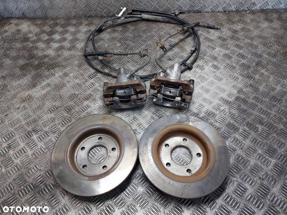 TARCZE HAMULCOWE TYŁ + KLOCKI + ZACISKI FORD FOCUS MK3 - 7