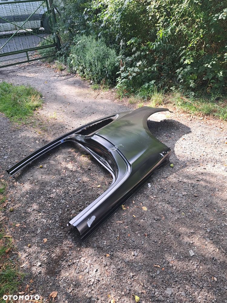 Błotnik lewy tył tylny Opel Astra J 4 IV GTC Lewe poszycie tylnego błotnika Opel Astra J GTC - 4