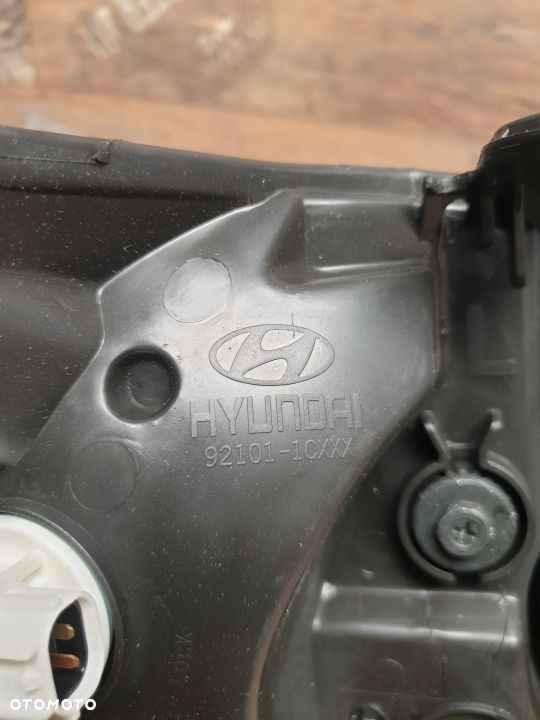 Oryginalna lampa lewa reflektor Hyundai Getz 92110-1C010 - 7