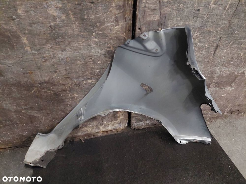 BŁOTNIK LEWY PRZÓD TOYOTA YARIS II LIFT 1F8 - 5