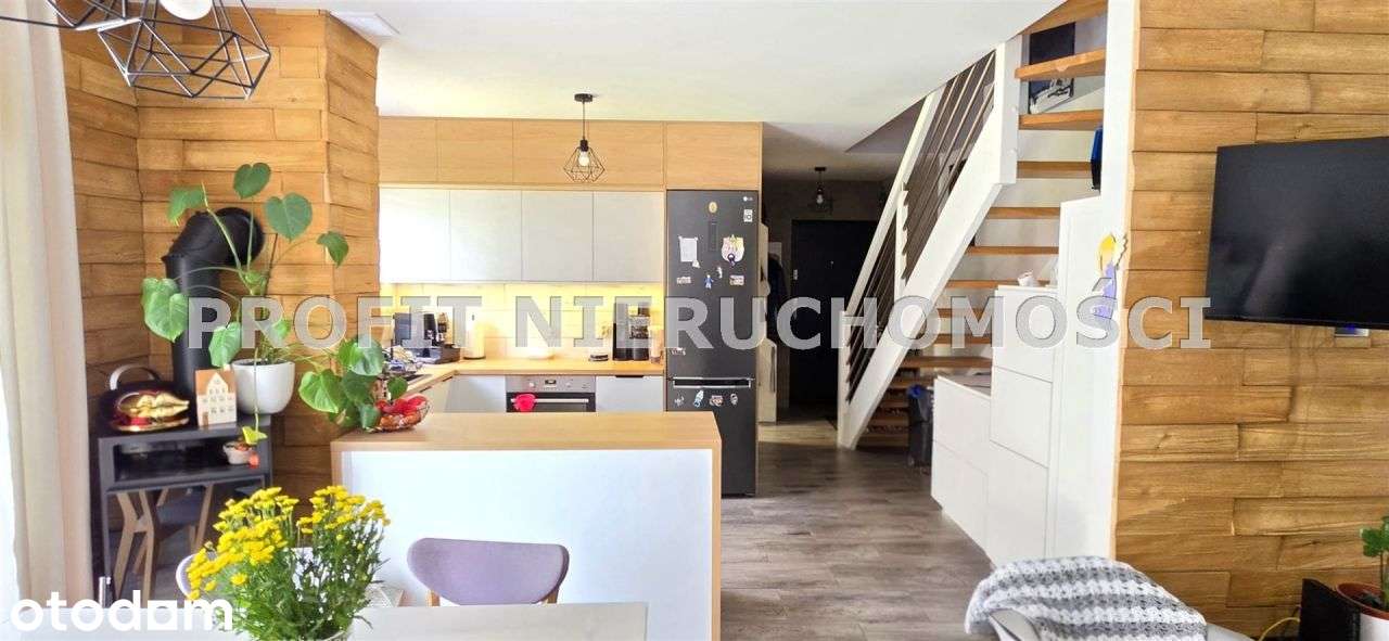 Nowoczesny apartament dwupoziomowy z ogródkiem