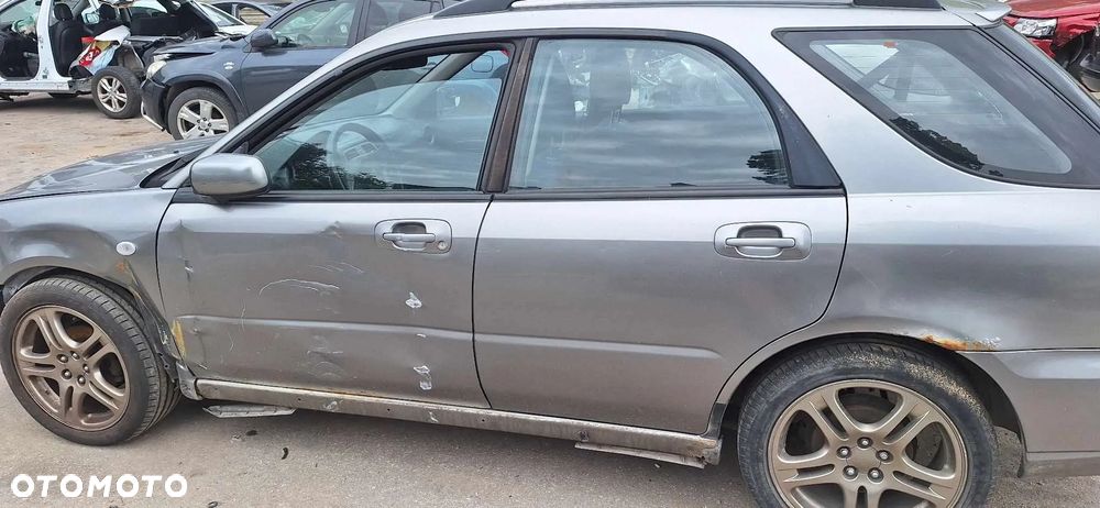 SUBARU IMPREZA II lift 45A kombi lampa lewy przód - 9