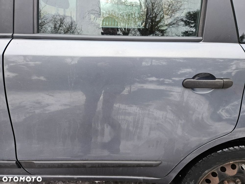 Nissan Note E11 07 drzwi tył tylne  lewe B52G - 1