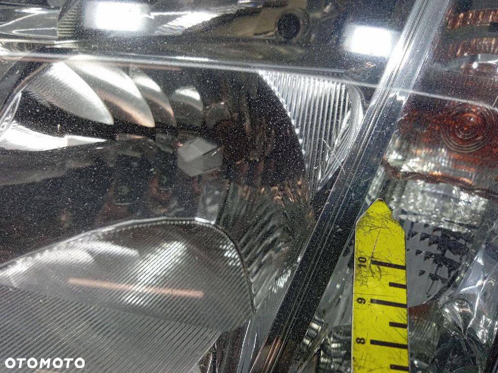 OPEL MERIVA I REFLEKTOR LEWY EU 89308550 - 9