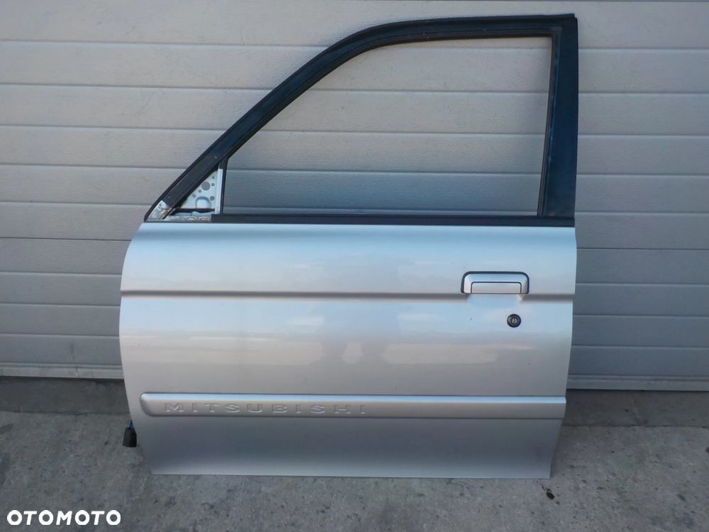 MITUBISHI PAJERO SPORT DRZWI LEWE PRZÓD - 1