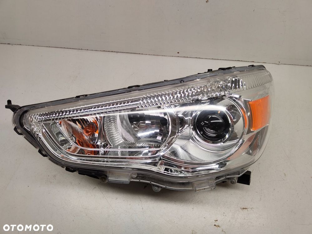 mitsubishi outlander ii 10-16 reflektor lampa lewa zwykła - 1