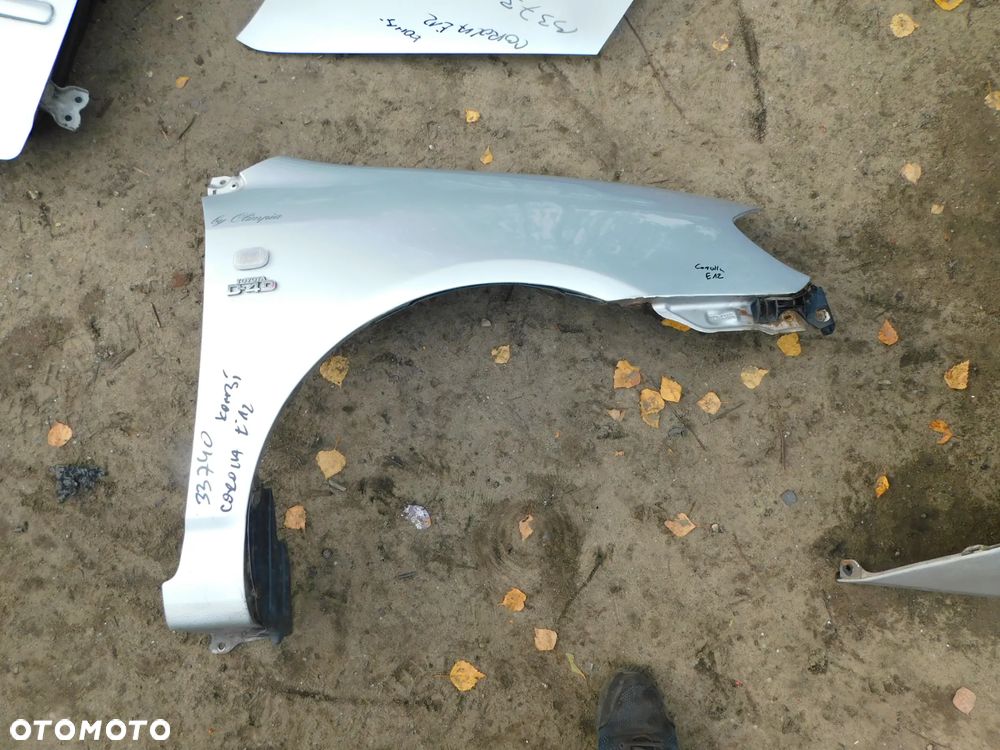 toyota corolla E12 błotnik kombi  nr 33740 WYSYŁKA - 1