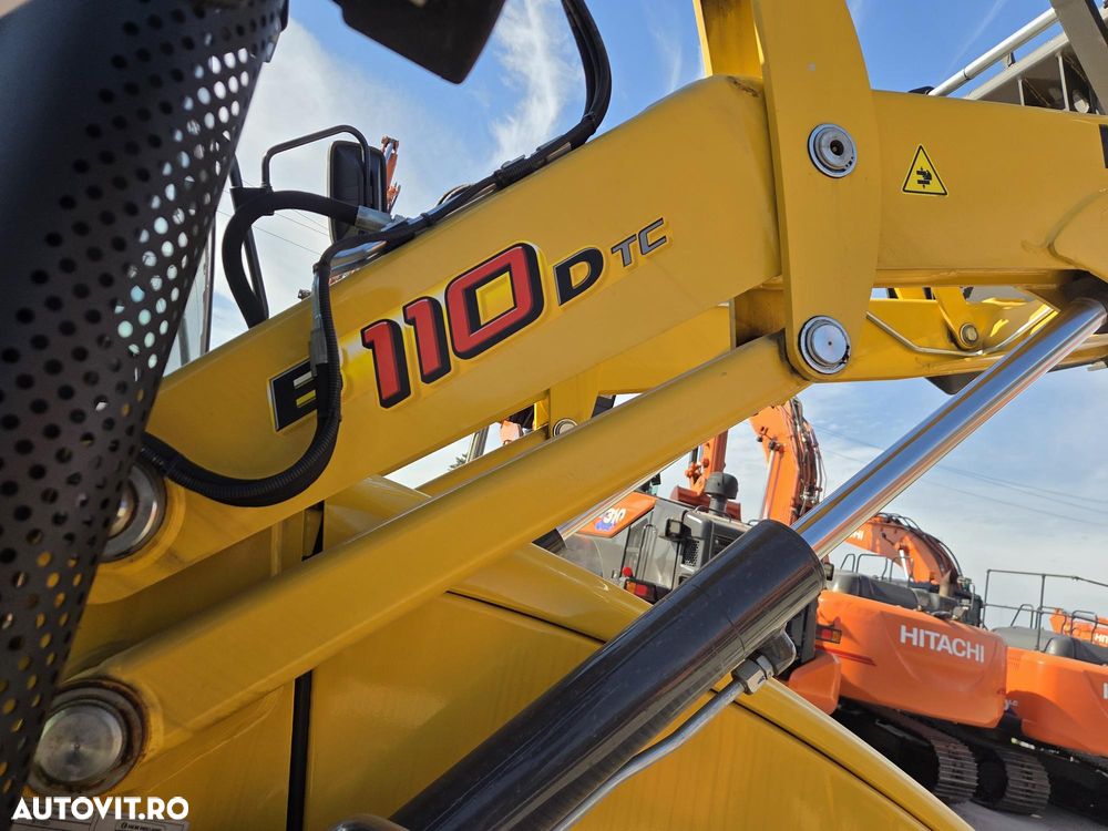 New Holland B110D NOU -nefolosit, FULL OPTION, Masa operatinoala 9,5 tone, motor 120CP euro6 cu Ad Blue, Certificat CE Atestat RAR, Cupa multifuncitonala 4x1, FURCI paleti, Brat excavare extensibil, anv MICHELIN, Aer cond, cutie POWERSHIFT, PROMOTIE 84900 EUR+T - 20