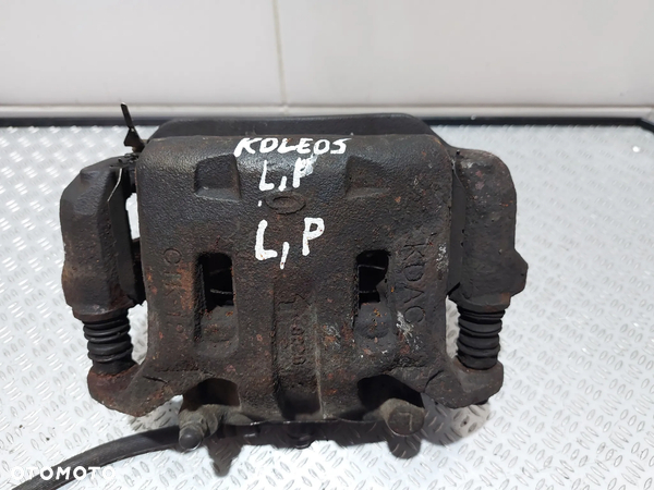 ZACISK HAMULCOWY LEWY PRZÓD RENAULT KOLEOS R2009 2,5 B