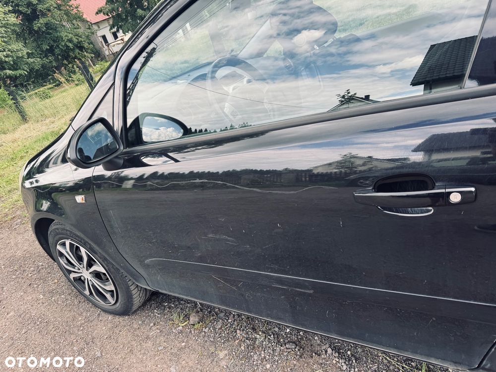 Opel Corsa 1.4 16V Enjoy - 11