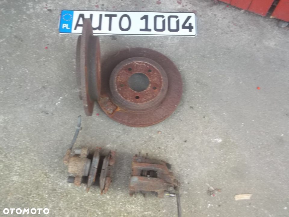 FORD MAVERICK MAZDA TRIBUTE ZACISK HAMULCOWY TYL TARCZ MAZDA TRIBUTE