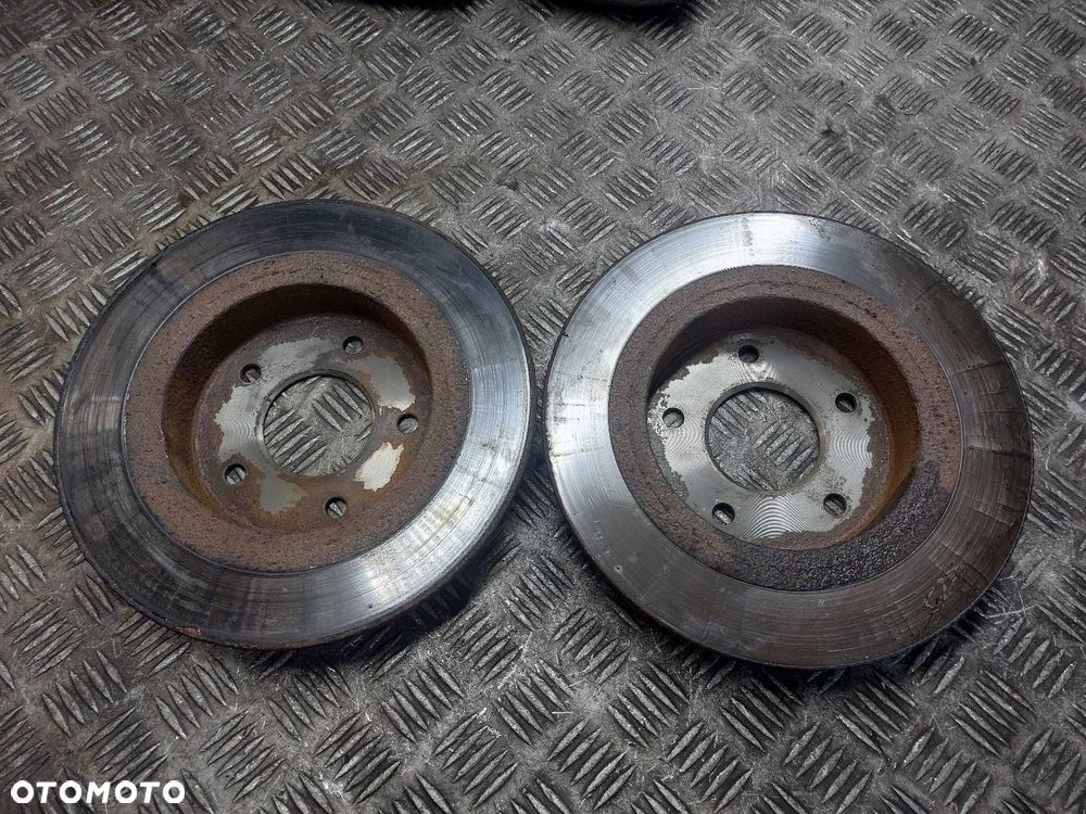 TARCZE HAMULCOWE TYŁ + KLOCKI + ZACISKI NISSAN PRIMERA P12 ID: 238850 - 7