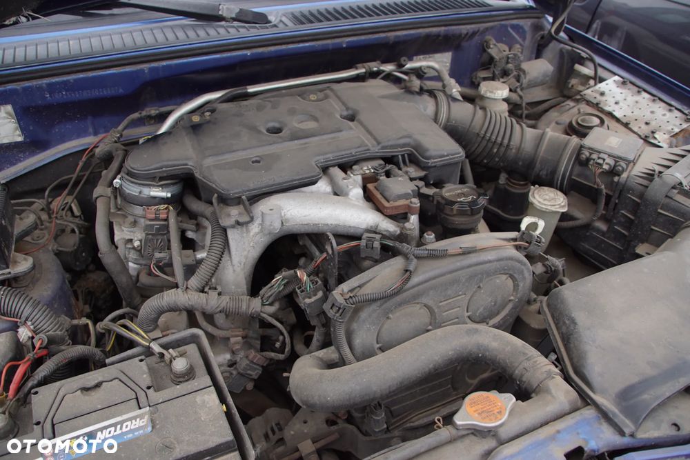 Auto na części - Mitsubishi Pajero Pinin 2.0 GDI 129 KM 4G94 V5M21 TH9B 2003R Silnik Skrzynia Drzwi Maska Błotnik Klapa Zderzak Lampa Lusterko Klamka Szyba Deska Kokpit Sterownik Moduł Czujnik Licznik Wyświetlacz Panel Kierownica - 16
