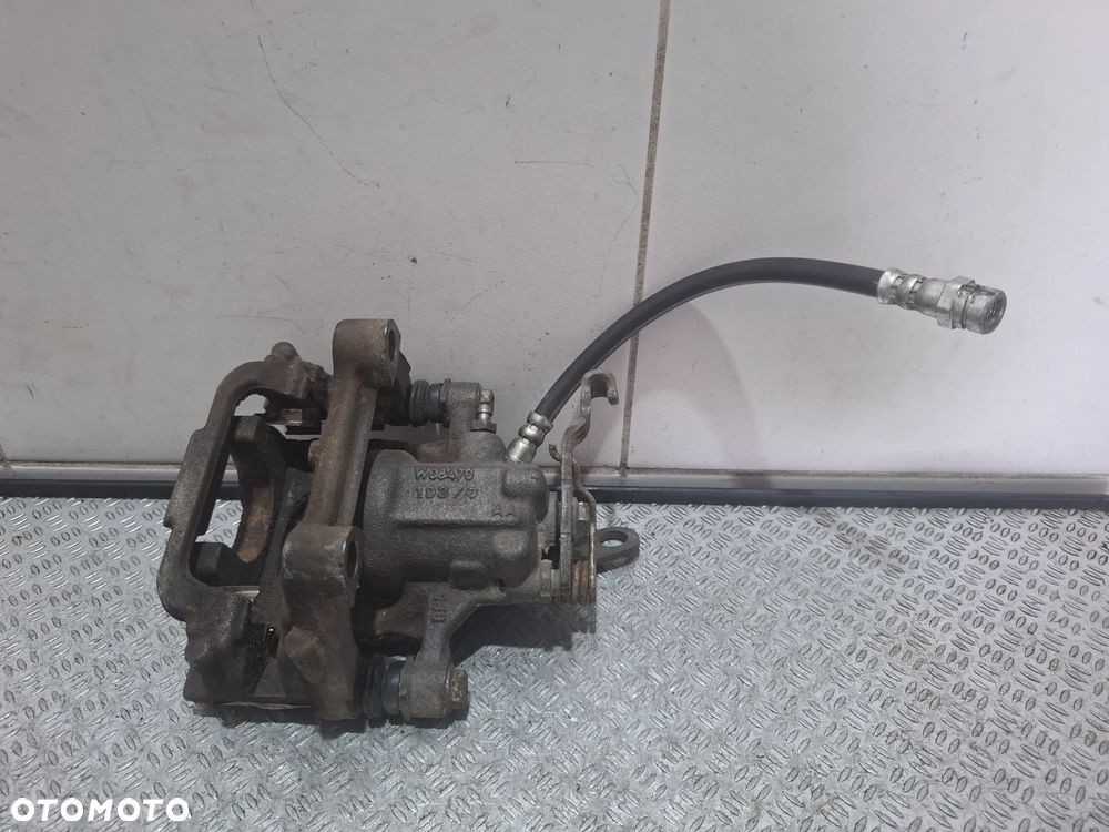 Zacisk lewy tył Skoda Superb 2014 rok - 2