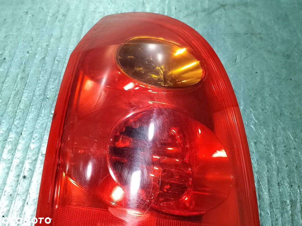 LAMPA TYLNA LEWA NISSAN PRIMERA P12 ( 03-07 ) 1.9 DCI KOMBI 26555AU40A - 1