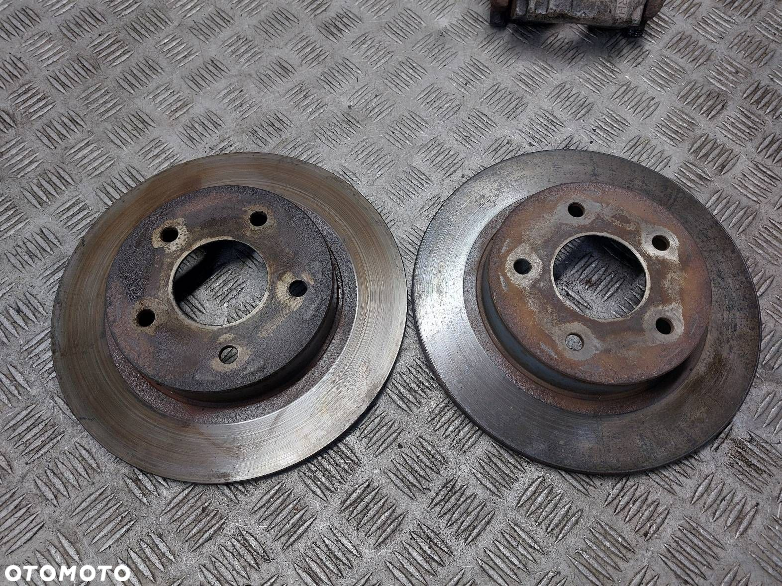 TARCZE HAMULCOWE TYŁ + ZACISK PRAWY NISSAN PRIMERA P12 - 2