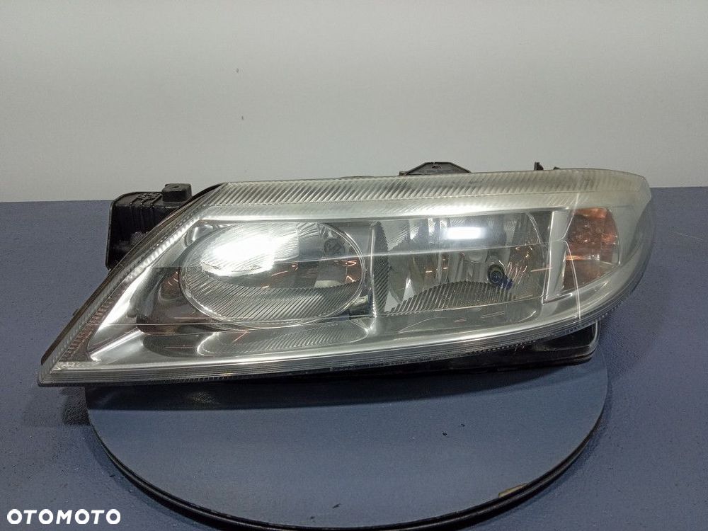 RENAULT LAGUNA II REFLEKTOR LEWY LAMPA H7 EU 7701048927 - 1